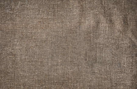 Burlap close-up, natural coarse cloth, tablecloth with foldsの写真素材