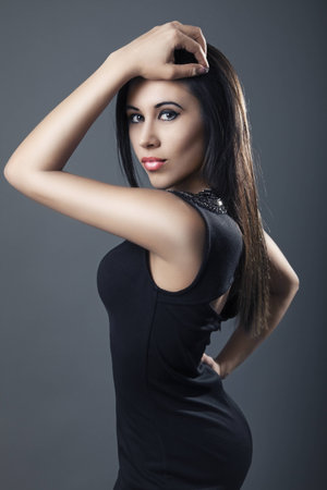 Beautiful woman wearing black dressの写真素材