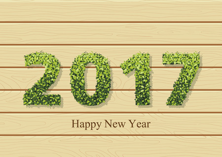 Happy holidays card with leaves on text 2017 and greeting text. 2017 new year color card on the wood texture.のイラスト素材