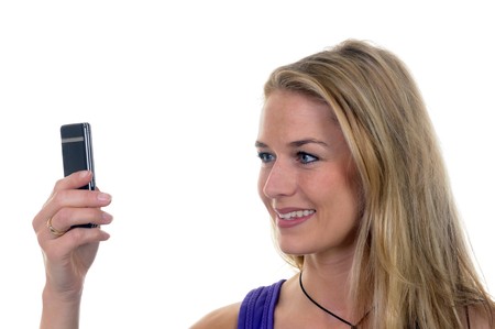 young woman with handyの写真素材