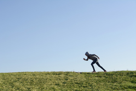 teenager jogging on a meadow