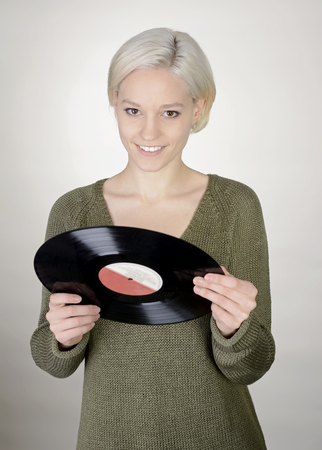 happy young woman with recordの写真素材