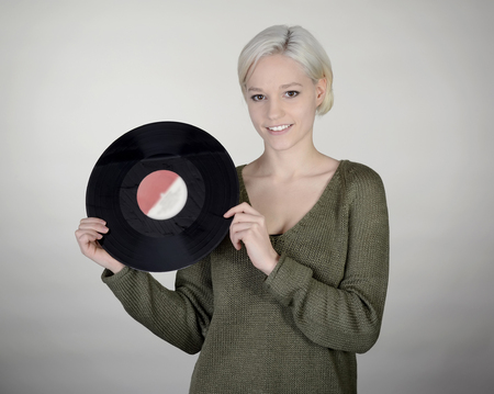 happy young woman with recordの写真素材