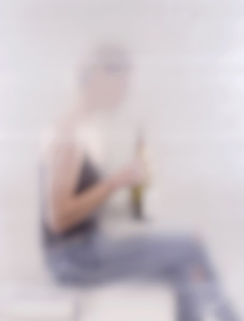 young blond woman with alcoholの写真素材