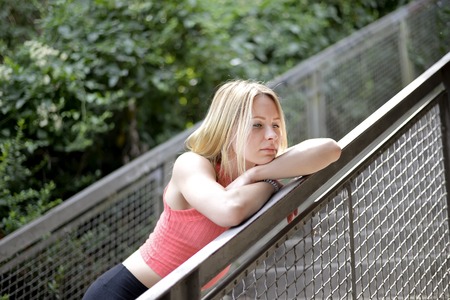 thoughtful young blond womanの写真素材