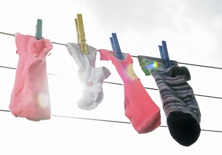 colourful stockings on the clothesline , lens flareの写真素材