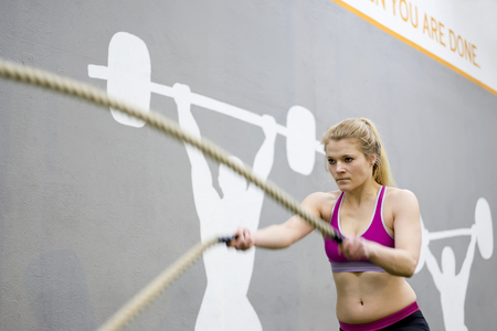 young blond woman  in fitness centerの写真素材