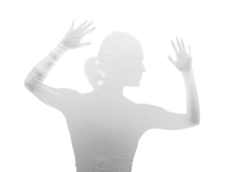  afraid young woman behind foilの写真素材