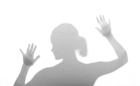  afraid young woman behind foilの写真素材