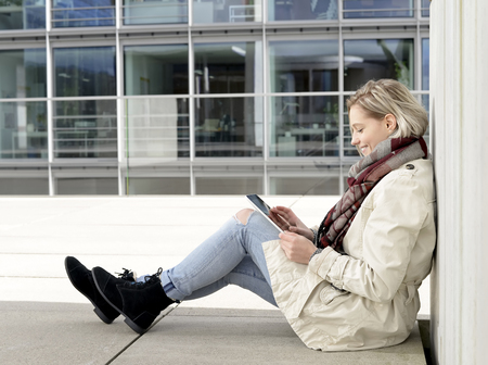  beautiful young woman using digital tablet