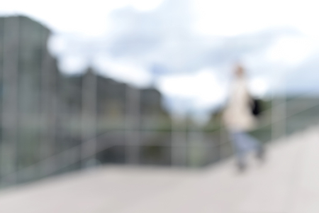  beautiful young woman in the city, blurred backgroundの写真素材