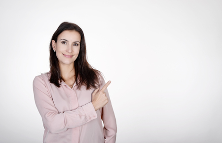 happy businesswoman pointing with fingerの写真素材