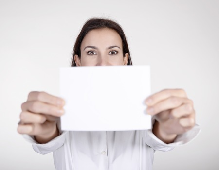  businesswoman presenting white business cardの写真素材