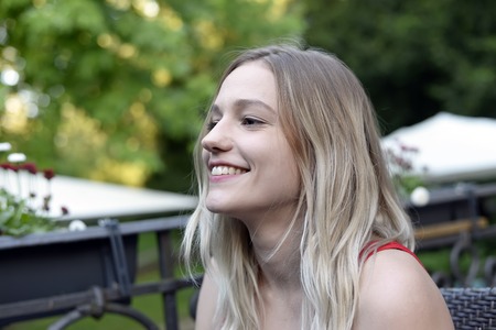 laughing young woman with blond hairsの写真素材