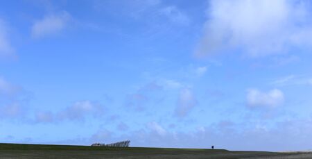 strollers on dikeの写真素材