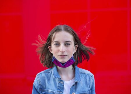 girl with mouthguard against red backgroundの写真素材