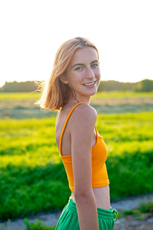 happy young girl on a meadowの写真素材