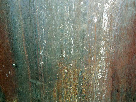 Metal, rusty, worn, in drops of paintの写真素材