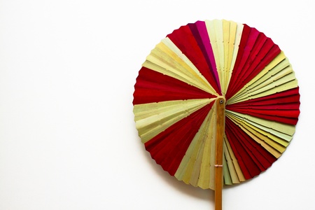 Folding fan isolated on a white background.の写真素材