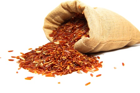 red jasmine rice and beaker on a white backgroundの写真素材