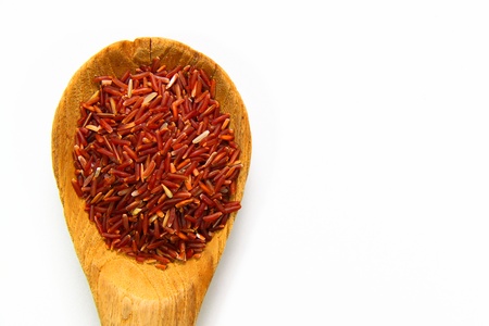 Red Jasmine Rice And Ladle On A White Backgroundの写真素材