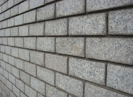 Fragment of white brick walls contrasting rhythmic pattern