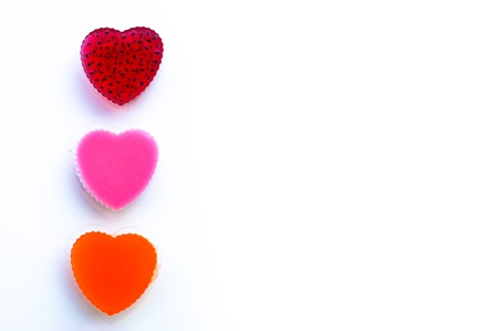 row of sweetness jelly shaped heart isolated on white backgroundの写真素材