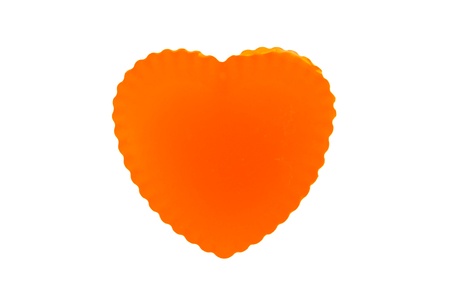 isolated orange thai jelly shaped heart on white backgroundの写真素材