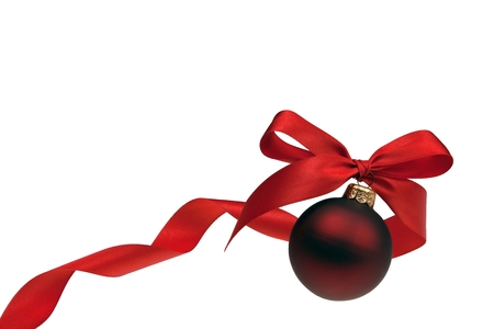 Christmas bauble with red ribbon isolated on white backgroundの写真素材