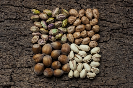 Composition with nuts, hazelnuts and pistachios close upの写真素材