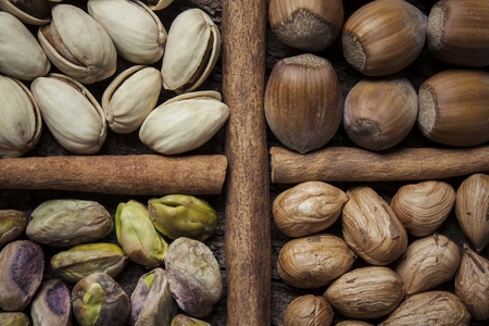 Composition with nuts, hazelnuts and pistachios close upの写真素材