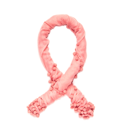 Pink aids ribbon of twisted delicate fabric isolated on white background.の写真素材