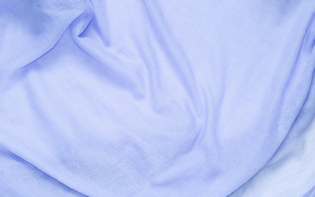 delicate soft and wrinkled fabric blue color background texture.の写真素材