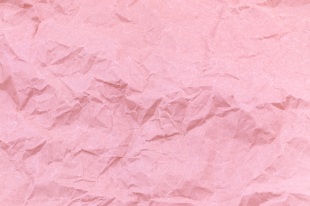 Texture of pink craft crumpled paper background.の写真素材