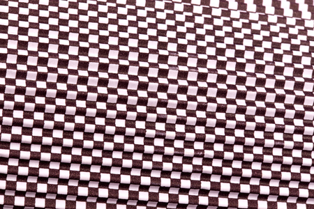 Abstract texture black white squares finish macro close-up background at close range.