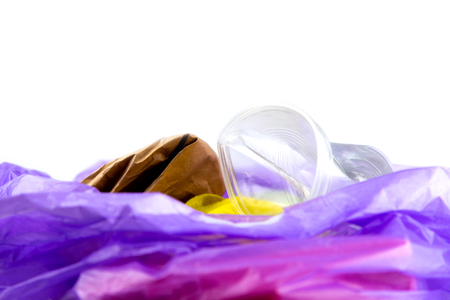 Concept of garbage and pollution. A pile of trash, crumpled plastic cup, packages, paper isolate on a white background.の写真素材