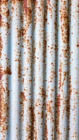 Vertical old metal sheet texture pattern. Rusty metal sheet texture.
