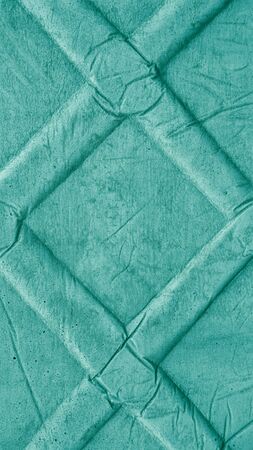 Vertical colored embossed paper texture, relief mint green background.