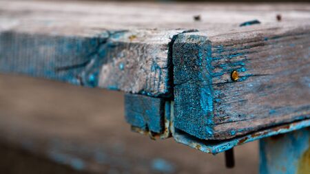 Close-up picture of an old wooden bench. Copy-space for writing.の写真素材