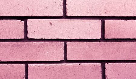 Modern pink brick wall texture or background. Cleaned structure of brickwork. Copy space.の写真素材