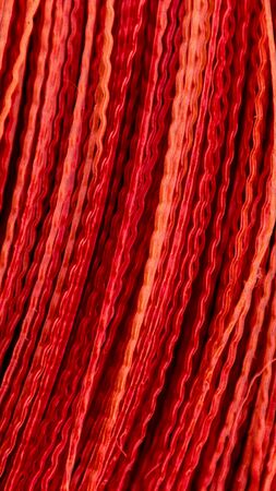 Vertical red Broom Stripes Abstract. Texture pattern close up detail macro. Abstract background.の写真素材