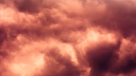 Dramatic stormy dark red green cloudy sky, natural photo background.