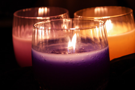 Three burning candlesの写真素材