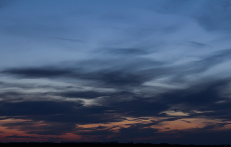 Colorful sunset with clouds in the eveningの写真素材