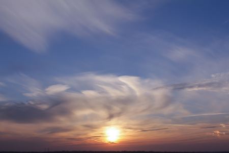 Clouds on the blue sky in the middle of a dayの写真素材