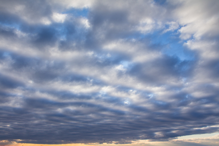 Clouds on the blue sky in the middle of a dayの写真素材