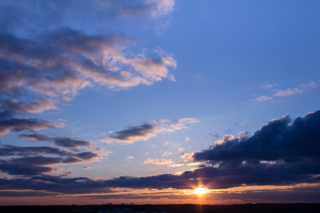 Colorful sunset with clouds in the eveningの写真素材