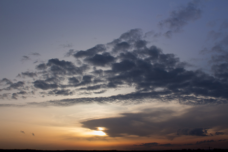 Clouds on the blue sky in the middle of a dayの写真素材