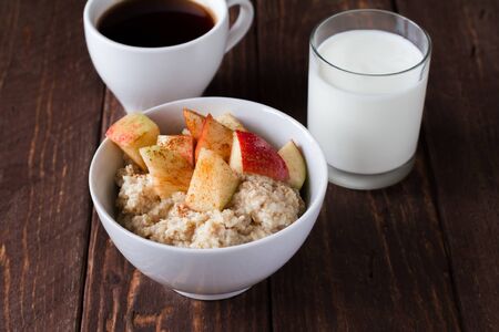 Healthy breakfast oatmeal with apples and cinnamonの写真素材