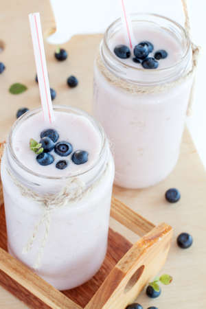blueberry smoothie in a little milk bottle
